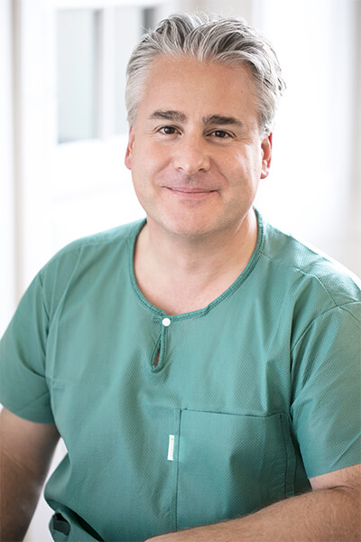 Portrait du docteur Kai-Uwe Schlaudraff, chirurgien esthétique au sein de la clinique de chirurgie esthétique "Concept Clinic" à Genève